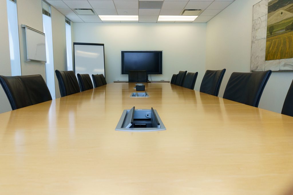 Large Conference room with white board and TV for multiple clients